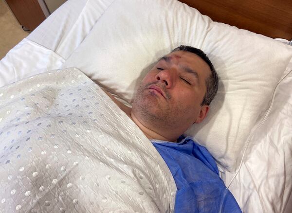 Turkish survivor Seref Demirtas rests in his hospital room.