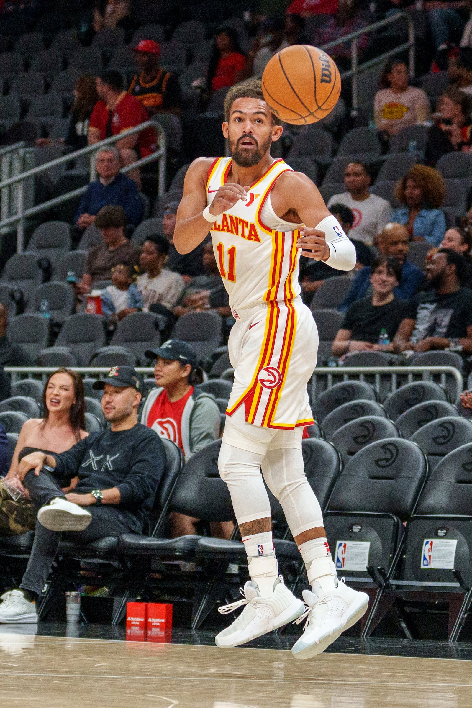 Atlanta Hawks guard Trae Young (11) takes the inbound pass during the first half of a preseason NBA basketball game against the Indiana Pacers, Tuesday, Oct. 8, 2024, in Atlanta. (AP Photo/Jason Allen)