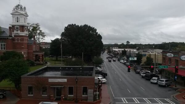 Officials in Lawrenceville, the county seat of Gwinnett, are pushing to expand redevelopment efforts beyond the town square, which already includes the old county courthouse, restaurants, shops and the Aurora Theatre. MATT KEMPNER / AJC