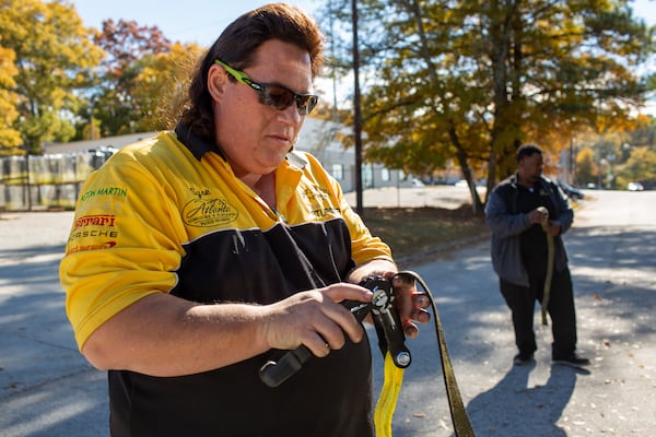 Syre Perkins, general manager at Tow Atlanta, shows off some of the technology the towing company uses at their Scottdale, Georgia, location on Thursday, November 21, 2019. Tow Atlanta has been investing in technology such as the TARVA, the Tow Atlanta Recovery Vehicle Autobot, to assist with safely towing both luxury and ordinary cars in Atlanta. (Photo/Rebecca Wright for the Atlanta Journal-Constitution)