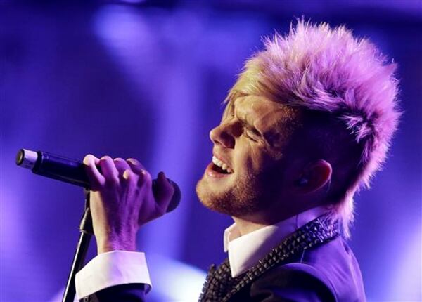 Colton Dixon performs at the Dove Awards on Tuesday, Oct. 15, 2013, in Nashville, Tenn. (AP Photo/Mark Humphrey)