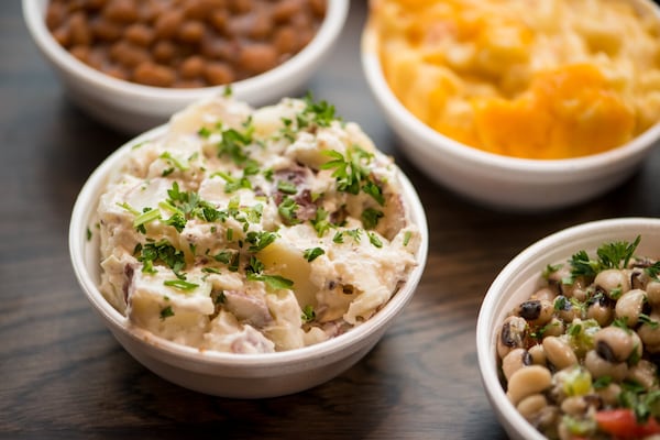 Hattie B's Hot Chicken Red Skin Potato Salad side (sides also pictured include Black Eyed Pea Salad, Pimento Mac and Cheese, and Baked Beans). Photo credit- Mia Yakel.