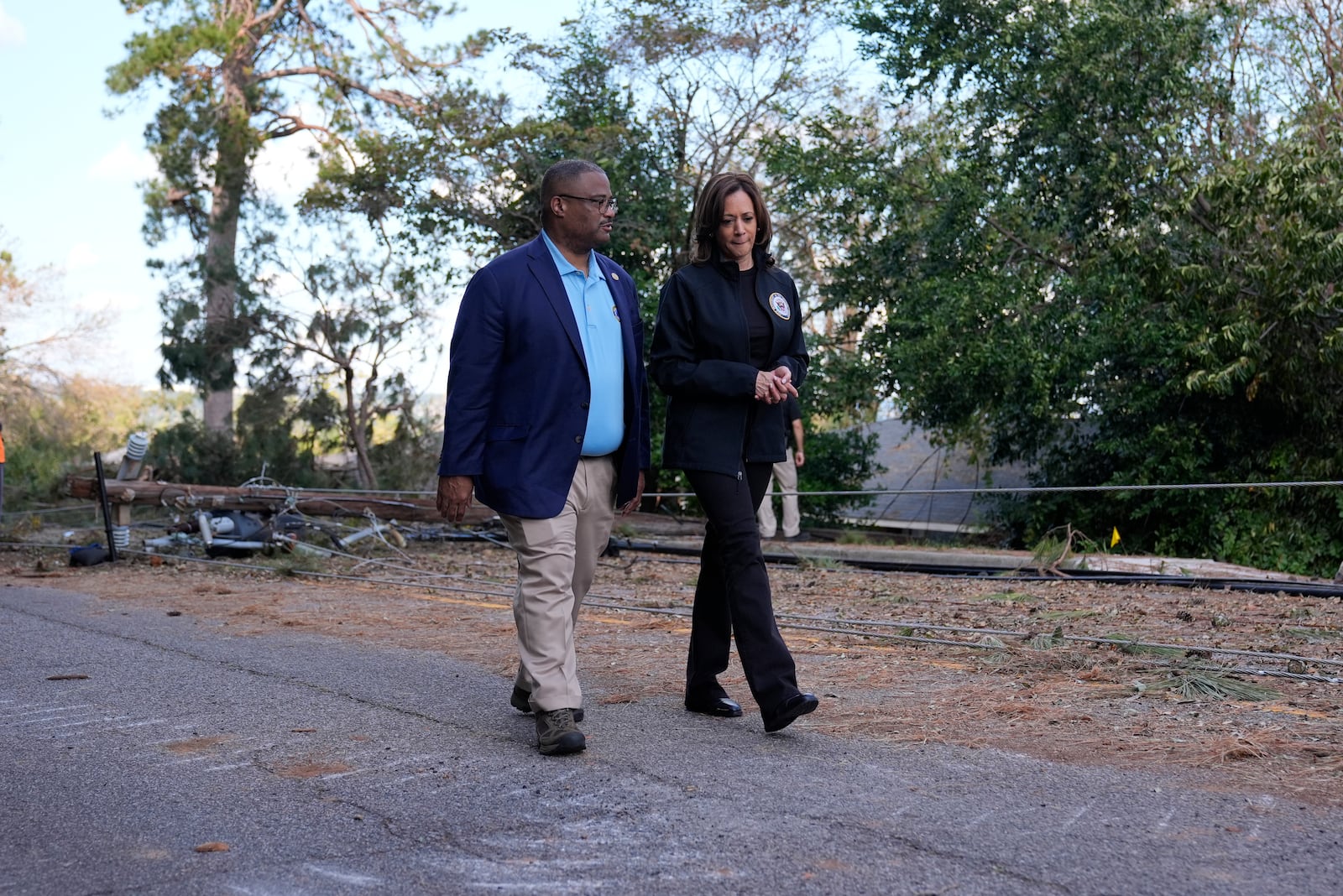 Democratic presidential nominee Vice President Kamala Harris walks with Augusta Mayor Garnett Johnson as she visits area impacted by Hurricane Helene in Augusta, Ga., Wednesday, Oct. 2, 2024. (AP Photo/Carolyn Kaster)