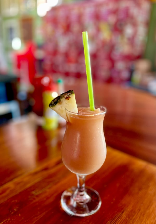 With an atmosphere as fun as the French Quarter, Gene's also serves a frozen hurricane to rival Pat O'Brien's. (Angela Hansberger for the AJC)