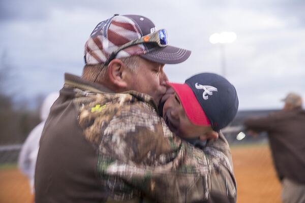 David Abernathy gives his grandson Carter Abernathy a kiss while playing a game of catch at Manning Mill Park in Adairsville. ALYSSA POINTER / ALYSSA.POINTER@AJC.COM