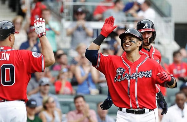  Rio Ruiz gets a high-five after his two-run homer off reigning NL Cy Young Award winner Max Scherzer on May 20. (AP photo)