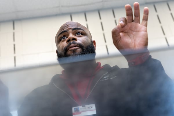 The Sound of Dutchtown high school marching band director Adrian Adams leads the band in practice at Dutchtown High School in Hampton on Thursday, May 25, 2023. The band will play at a D-Day commemoration ceremony in France. (Arvin Temkar / arvin.temkar@ajc.com)