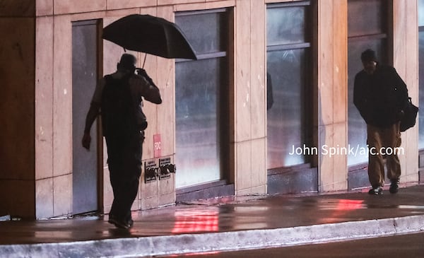 Umbrellas were out Wednesday morning on Peachtree Street near Marietta Street.