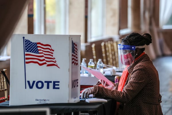 November 3, 2020 Atlanta: A poll worker sorts through voting material at Park Tavern in Atlanta on Tuesday, Nov. 3, 2020. Voters lined up outside polling places Tuesday morning to be among the first to cast their votes on a crucial Election Day. It’s expected to be the biggest day of voting in Georgia, with turnout reaching as high as 2 million. Another 3.9 million people already cast early or absentee ballots. Some told The Atlanta Journal Constitution that they expect social unrest whether Biden or Trump wins the election. (John Spink / John.Spink@ajc.com)

