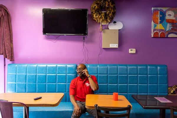 Larry Johnson, a candidate for DeKalb CEO, is seen at Talk of the Town restaurant in Decatur on Tuesday, March 19, 2024. Owner Val Price-Littleton is a supporter. (Arvin Temkar / arvin.temkar@ajc.com)