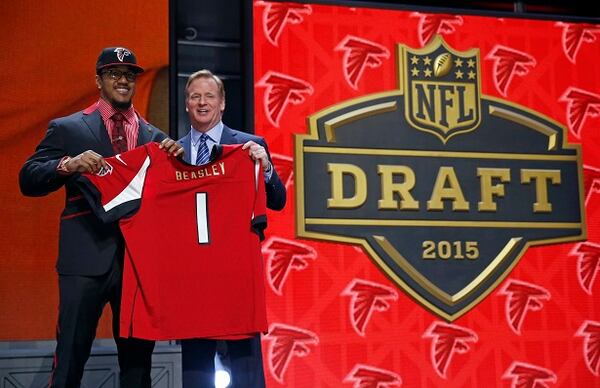 Clemson defensive lineman Vic Beasley poses for photos with NFL commissioner Roger Goodell after being selected by the Atlanta Falcons as the eighth pick in the first round of the 2015 NFL Draft, Thursday, April 30, 2015, in Chicago. (AP Photo/Charles Rex Arbogast) Vic Beasley with the commish. (AP Photo/Charles Rex Arbogast)