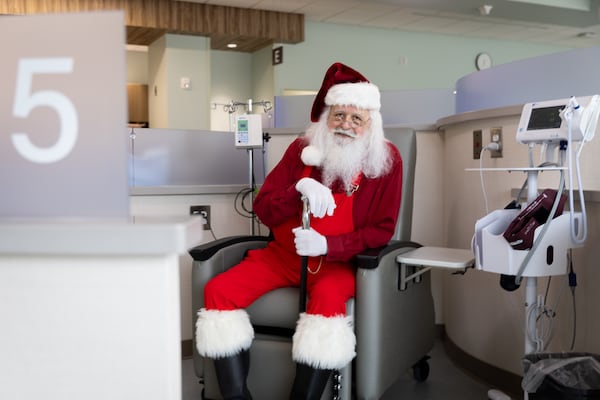 Former patient Jonathan Byrd, who is a favorite local Santa Claus, poses for a portrait at University Cancer & Blood Center in Athens on Wednesday, Dec. 18, 2024. Byrd’s cancer is in remission. (Arvin Temkar/AJC)