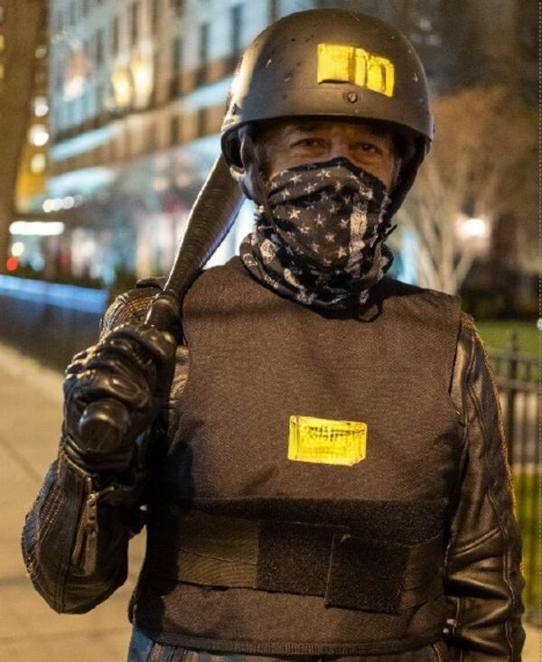 William Frederick Beals, 53, of Ringgold is seen here in a photo from Jan. 5, 2021, where prosecutors say he attended a rally in Washington to protest the certification of the 2020 presidential election. This photo has been edited to blur a profanity on the yellow stickers on his vest and helmet. (U.S. Department of Justice)