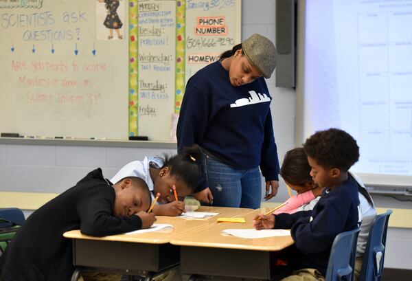 Science teacher Raven Foster leads her class at KIPP Central City Academy in New Orleans, one of the charter schools in a state-run "recovery" district created after Hurricane Katrina devastated the city. Ten years later, the governor of Georgia wants to replicate this approach. HYOSUB SHIN / HSHIN@AJC.COM