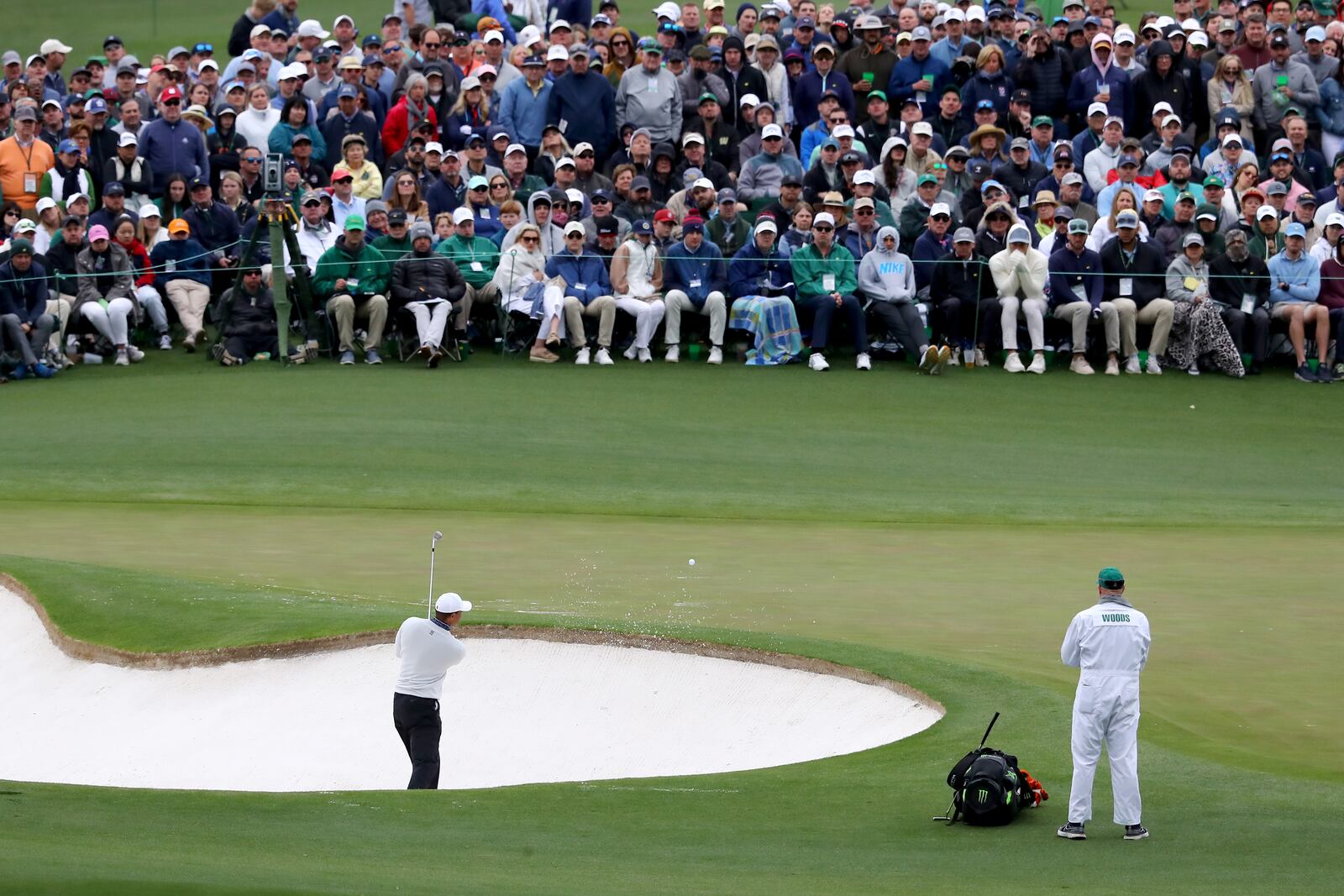 Tiger Woods hits out of a bunker on the second green during the third round of the Masters at Augusta National Golf Club on Saturday, April 9, 2022, in Augusta. (Curtis Compton / Curtis.Compton@ajc.com)