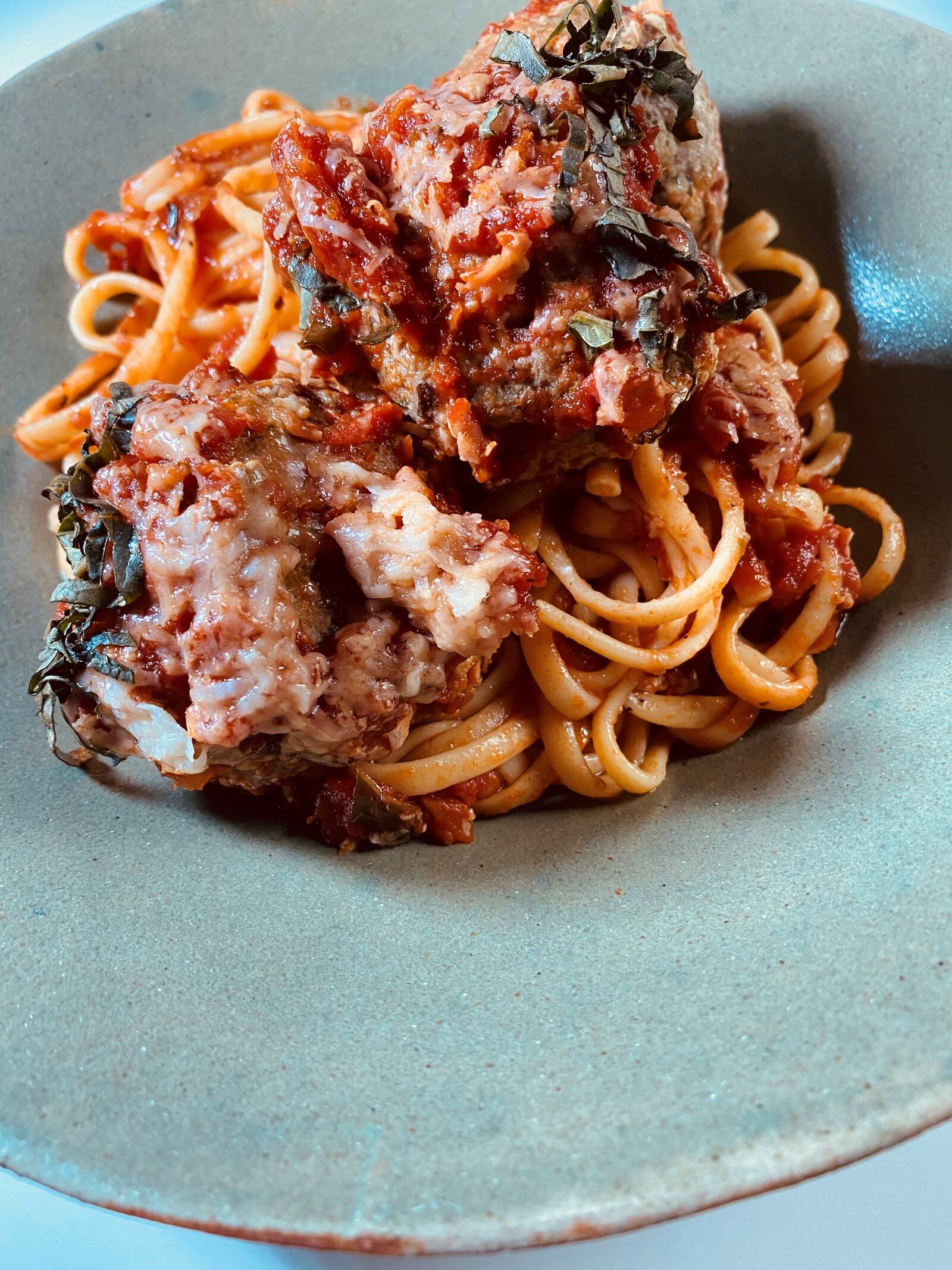 Nonna’s spaghetti and meatballs at Amalfi is served with house-made meatballs and San Marzano sauce. Bob Townsend for The Atlanta Journal-Constitution
