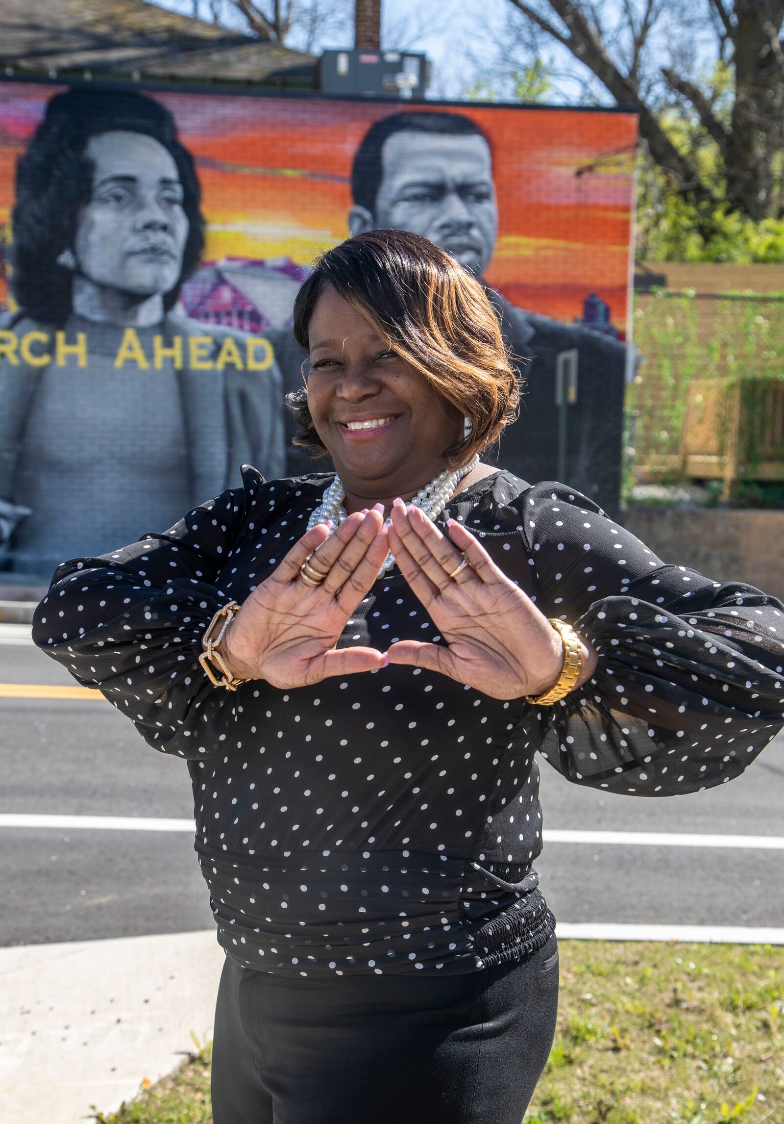 Coretta Hurt poses for a photo in Atlanta’s Vine City community, Friday, April 2, 2021. Named after Coretta Scott King, the health care administrator said: “My name is Coretta, so I cannot get in trouble." (Alyssa Pointer / Alyssa.Pointer@ajc.com)