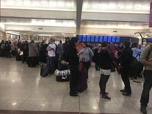 Delta lines at Hartsfield-Jackson on Friday morning, April 7, 2017.