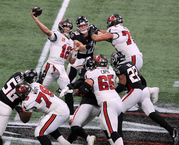 Buccaneers quarterback Tom Brady throws under pressure from the Falcons during the fourth quarter Sunday, Dec. 20, 2020, in Atlanta. (Curtis Compton / Curtis.Compton@ajc.com)