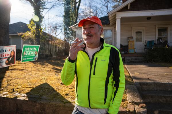 Matthew Garbett, community activist, stands in front of his home in Murphy Crossing on Tuesday, Jan. 14, 2025. (Olivia Bowdoin for the AJC)