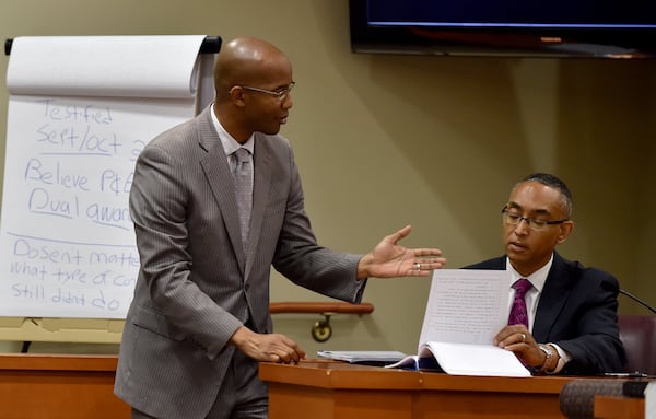 JUNE 23, 2015 — District Attorney Robert James asks Ellis to review prior testimony during Ellis’ second trial. BRANT SANDERLIN/BSANDERLIN@AJC.COM