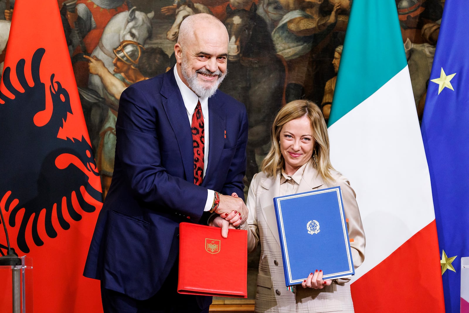 FILE - Italy's Premier Giorgia Meloni, right, and Albania's Prime Minister Edi Rama shake hands after the signing of a memorandum of understanding on migrant management centers during a meeting in Rome, Italy, on Nov. 6, 2023. (Roberto Monaldo/LaPresse via AP, File)