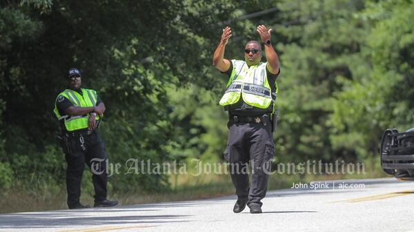 Barrow County deputies direct traffic Thursday, hours after a man was shot and killed by police after a chase.