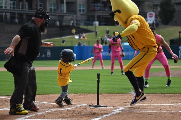 An young Savannah Bananas fan hits a home run during pregame ceremony event before first of three-game series at Coolray Field, Saturday, March 23, 2024, in Lawrenceville. The Savannah Bananas’ visit is their first to the Atlanta area since their founding in 2016. The team is based in their namesake Georgia city and plays 30-plus games a year at Historic Grayson Stadium, a century-old ballpark on Savannah’s eastside. (Hyosub Shin / Hyosub.Shin@ajc.com)