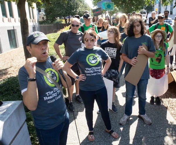 Organizer Jairo Garcia talks to the crowd in front of City Hall during the Climate Reality Strike March Friday, September 20, 2019. STEVE SCHAEFER / SPECIAL TO THE AJC