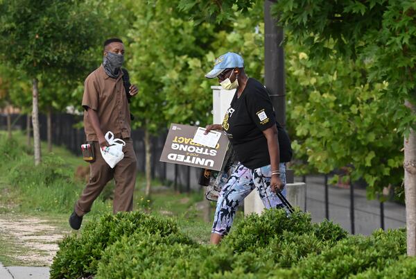 August 4, 2022 Atlanta - A rally participant leaves, after a contract rally in preparation for negotiations with UPS coming up over the next year, at UPS SMART Hub in Atlanta on Thursday, August 4, 2022. The Teamsters were holding a contract rally among workers in preparation for negotiations with UPS coming up over the next year. (Hyosub Shin / Hyosub.Shin@ajc.com)