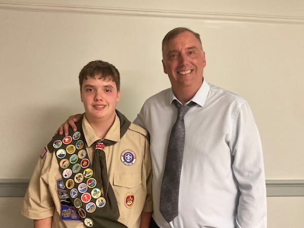 Nathaniel Van Brimmer, left, poses with his dad and AJC reporter Adam Van Brimmer after earning the rank of Eagle Scout.