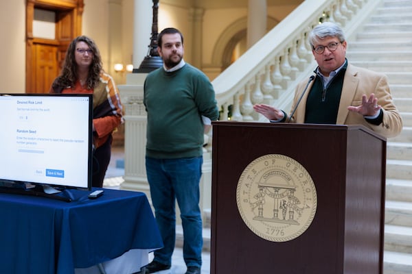 Gabriel Sterling, right, chief operating officer for the secretary of state's office, speaks before beginning the process of auditing the 2022 election. A plan that would have added another layer to the audit process is now on hold while a protest filed by a company that lost out on a contract bid works its way through the system. (Arvin Temkar / arvin.temkar@ajc.com)