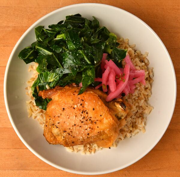 Warm Grain Bowl with Sauteed Greens, Crispy Chicken and Pickled Onions. Styling by Jennifer Hill Booker. (CHRIS HUNT FOR THE ATLANTA JOURNAL-CONSTITUTION)