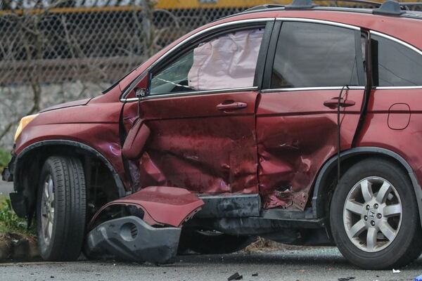 A Honda CR-V had significant damage to its left side from the crash.