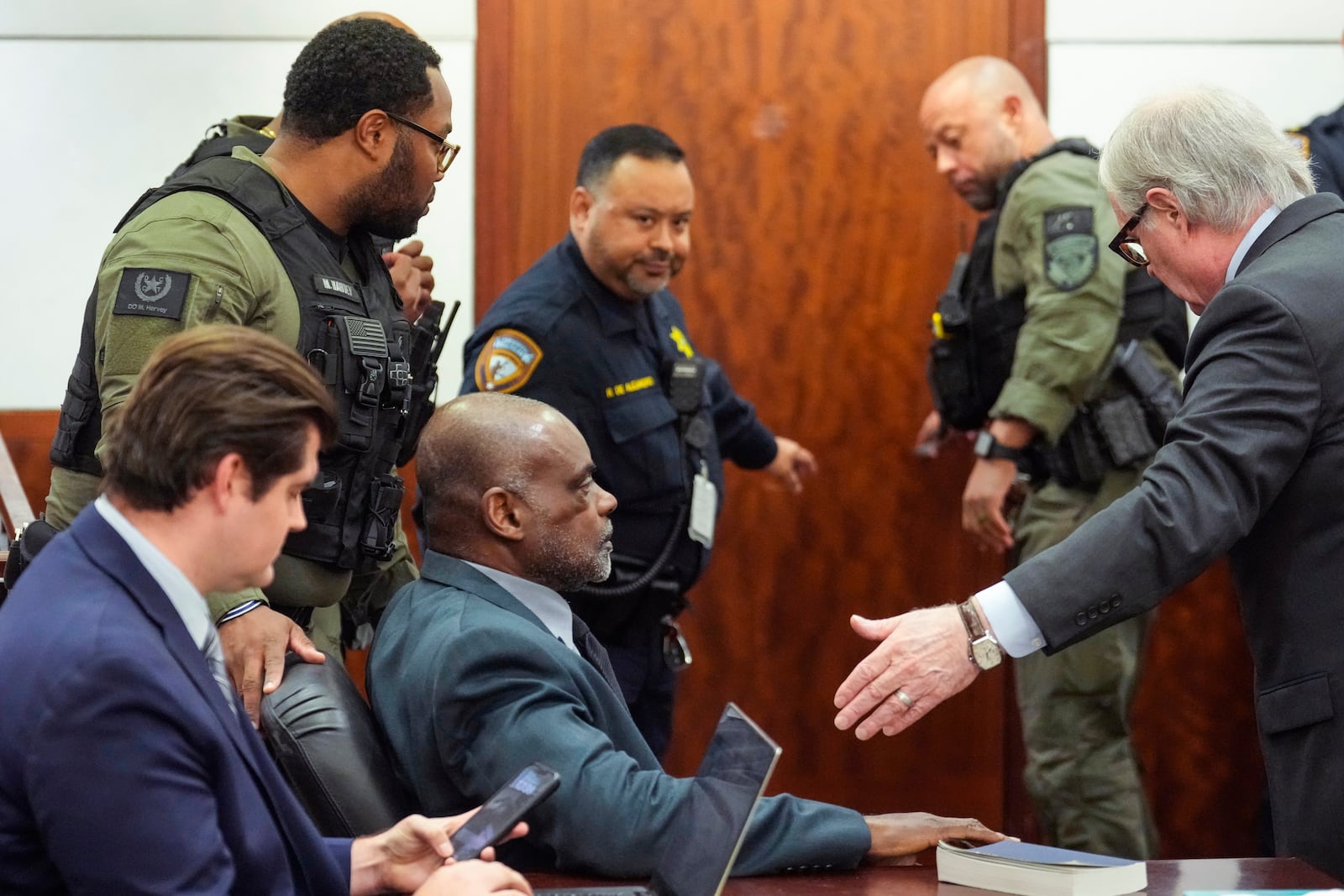 Former Houston police officer Gerald Goines sits in the courtroom after he was sentenced to 60 years behind bars on a pair of felony murder convictions on Tuesday, Oct. 8, 2024, in Houston. Goines was found guilty of felony murder in the 2019 deaths of Dennis Tuttle and Rhogena Nicholas. (Brett Coomer/Houston Chronicle via AP)