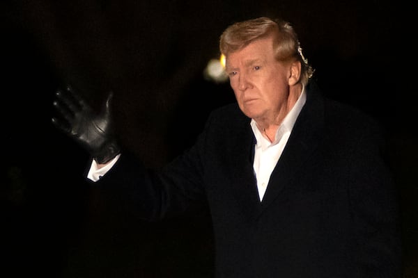 President Donald Trump gestures as he walks across the South Lawn of the White House, Sunday, March 2, 2025, in Washington, after returning from a trip to Florida. (AP Photo/Mark Schiefelbein)