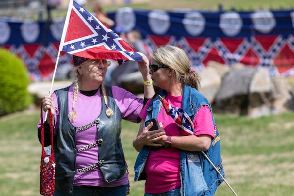 Katy Walker (Left) and Lisa Wallace wait for the speakers to start during the Confederate Memorial Day at Stone Mountain Park Saturday, April 29, 23.  (Steve Schaefer/steve.schaefer@ajc.com)