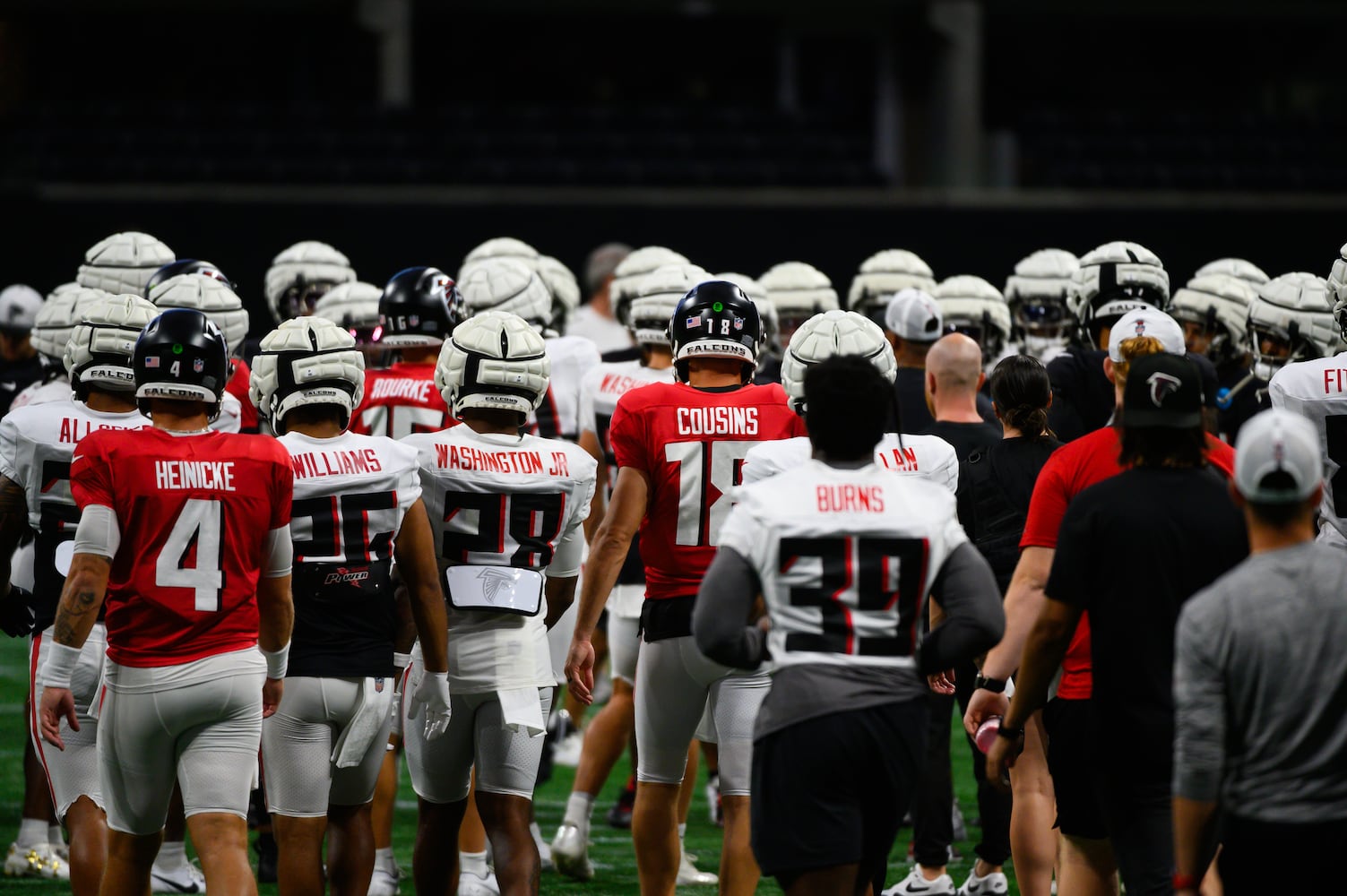 Falcons players head out to midfield together. (Jamie Spaar for the Atlanta Journal Constitution)