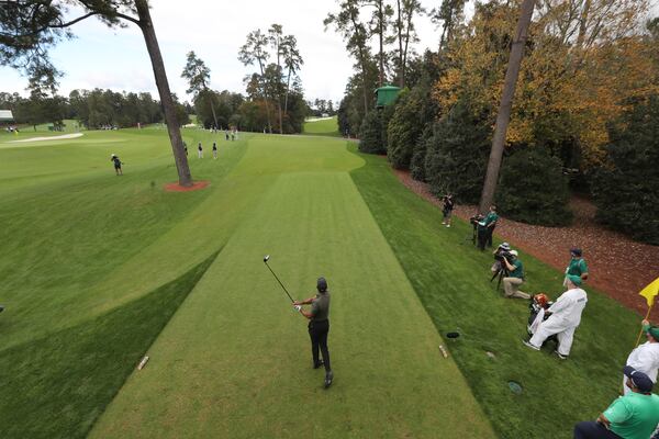 Tiger Woods tees off on the 18th hole during the first round of the Masters Tournament Thursday, Nov. 12, 2020, at Augusta National. (Curtis Compton / Curtis.Compton@ajc.com)