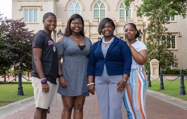 Shanoca French and her three children, Alex (L), Alexis, and Madison (R), pose for a photograph at the Georgia Military College Preparatory School in Milledgeville Wednesday, May 24, 2022. (Steve Schaefer / steve.schaefer@ajc.com