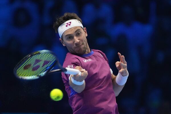 Norway's Casper Ruud returns the ball to Russia's Andrey Rublev during their singles tennis match of the ATP World Tour Finals at the Inalpi Arena, in Turin, Italy, Friday, Nov. 15, 2024. (AP Photo/Antonio Calanni)