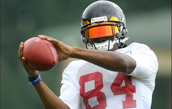 Falcons' 11-year veteran wide receiver Roddy White catches a pass during team practice Tuesday in Flowery Branch. Curtis Compton/www.ajc.com