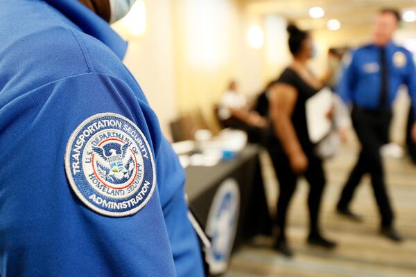 People gather inside the Holiday Inn & Suites near the Atlanta airport, where the Transportation Security Administration held a job fair. TSA offers a $1,000 signing bonus for Atlanta airport jobs during the recruiting event Tuesday and Wednesday, June 7-8. Miguel Martinez / miguel.martinezjimenez@ajc.com