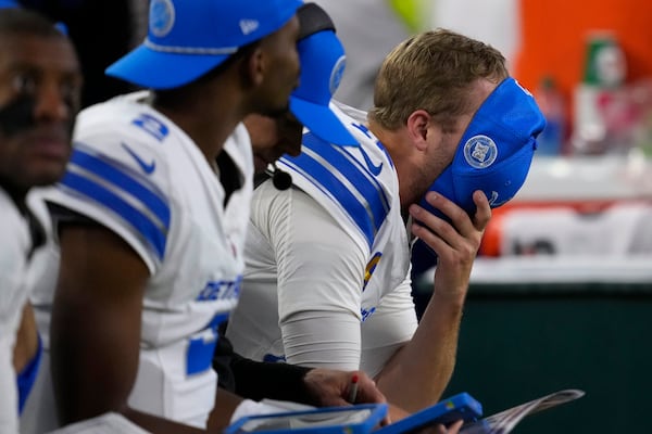 Detroit Lions quarterback Jared Goff reacts on the bench after throwing an interception during the second half of an NFL football game against the Houston Texans, Sunday, Nov. 10, 2024, in Houston. (AP Photo/David J. Phillip)