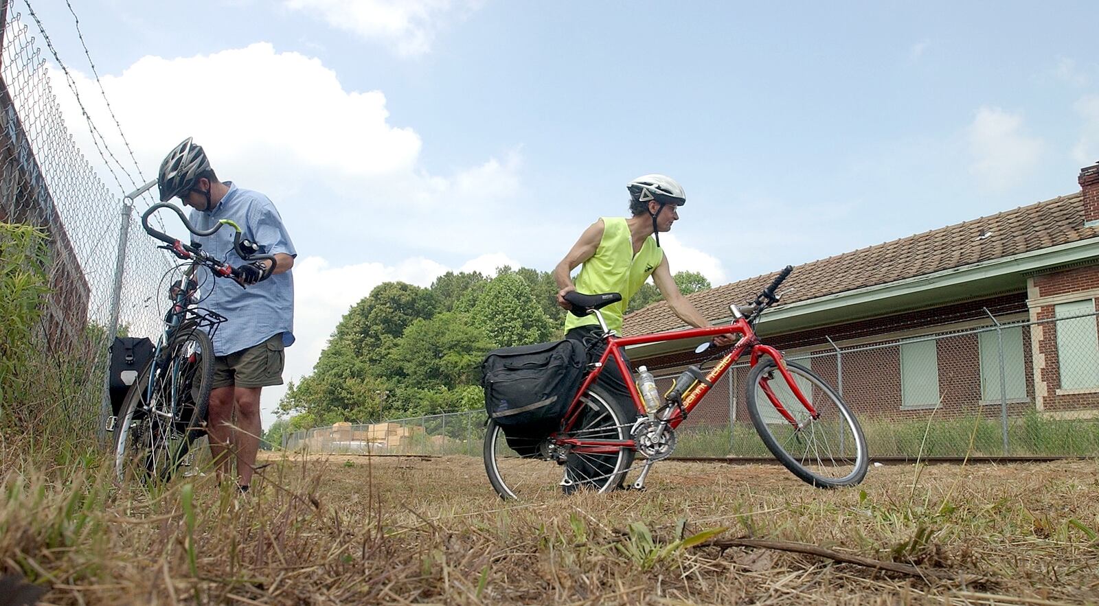 The caption on this 2004 file photo read: "The Belt Line is proposed to intersect this site at the old train depot at Memorial Drive and the Glenwood Connector. These two bike riders attended prepare to cycle away from the press conference site and are (left to right) Kevin Whited and Dennis Hoffarth. Both are sympathetic to the Atlanta Bicycle Campaign and are avid city bikers."