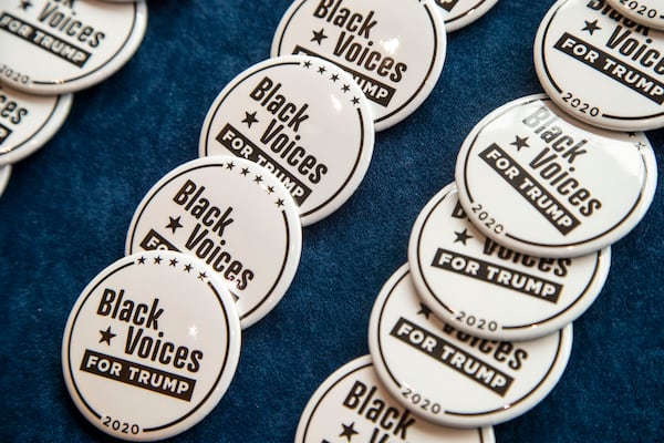 09/25/2020 - Atlanta, Georgia - Campaign pins are available for purchase before the start of a Blacks for Trump campaign rally at the Cobb Galleria Centre in Atlanta, Friday, September 25, 2020.  (Alyssa Pointer / Alyssa.Pointer@ajc.com)