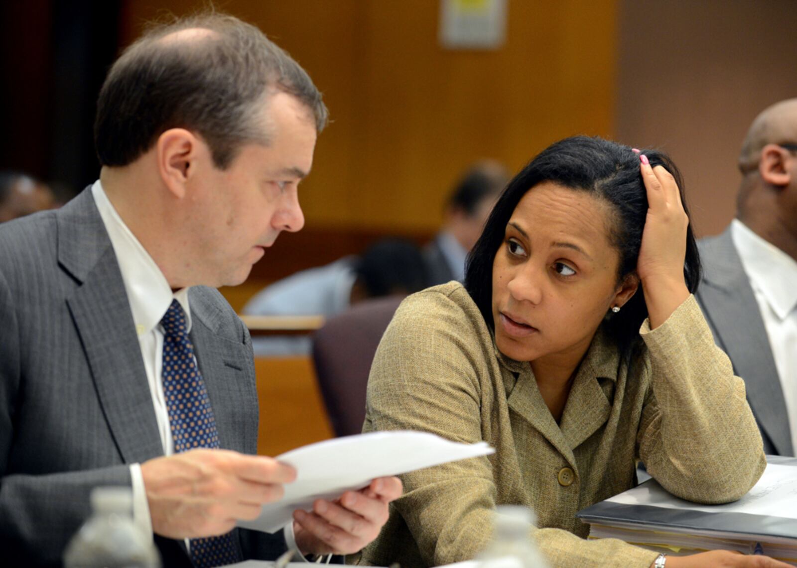 Fulton County assistant district attorneys John Floyd and Fani Willis confer during testimony in the Atlanta Public Schools cheating case on June 18, 2013 . 