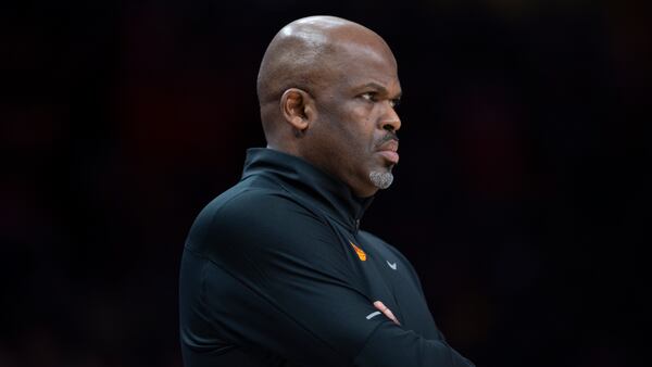 Atlanta Hawks head coach Nate McMillan watching the game during the first half of an NBA basketball game against the New York Knicks Saturday, Nov. 27, 2021, in Atlanta. (AP Photo/Hakim Wright Sr.)