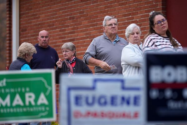 Voters stand in line while waiting for a polling place to open, Tuesday, Nov. 5, 2024, in Springfield, Pa. (AP Photo/Matt Slocum)