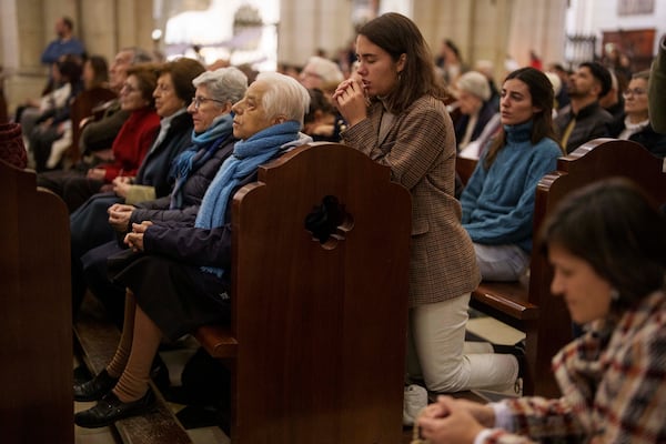 People pray for Pope Francis at Almudena Cathedral in Madrid, Spain, on Thursday, Feb. 27, 2025. (AP Photo/Manu Fernandez)